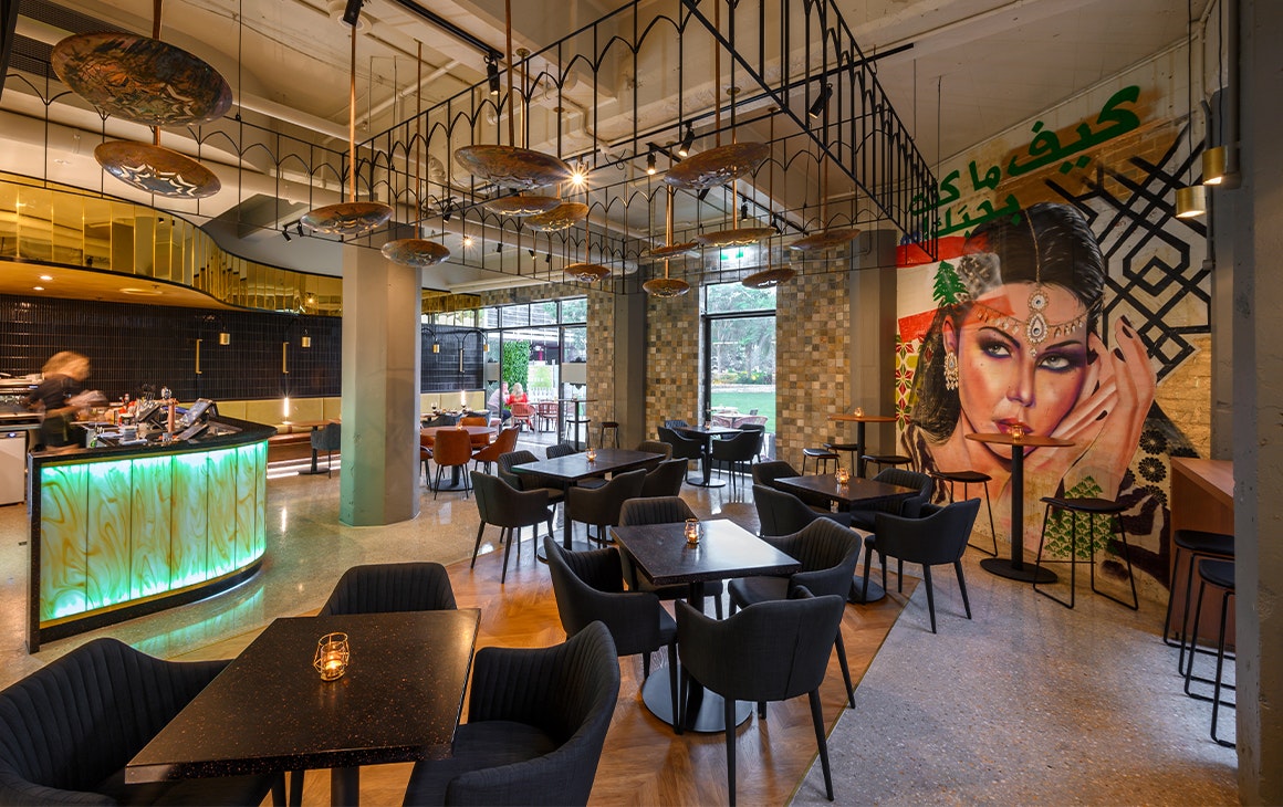 interior of a restaurant with a mural